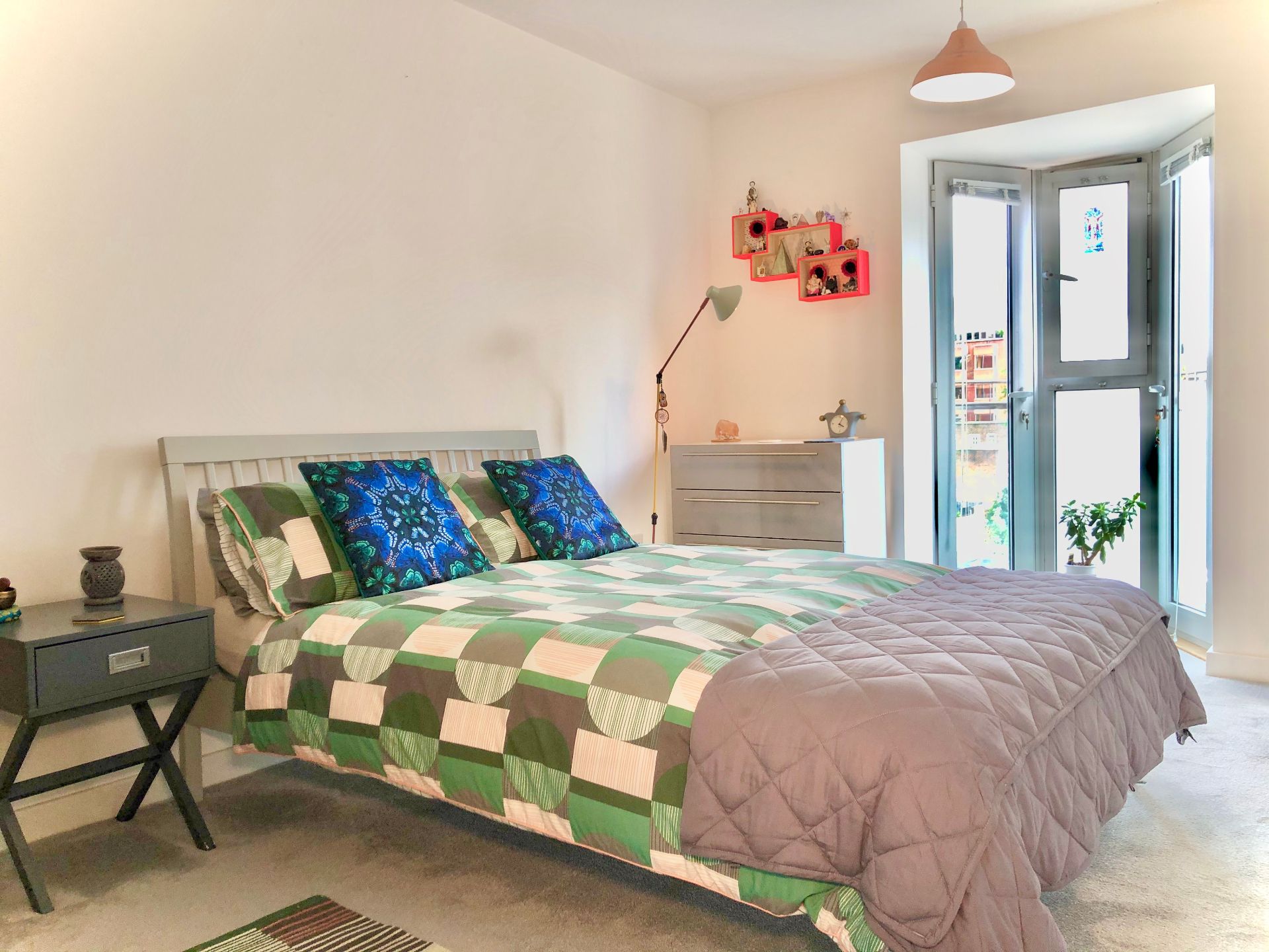 Modern bedroom with balcony access in Romford rental property