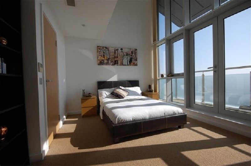 Bright penthouse bedroom in rental property managed in Romford